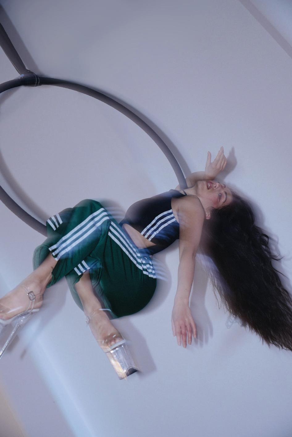 Aerial hoop pose at Slink Pole Studio